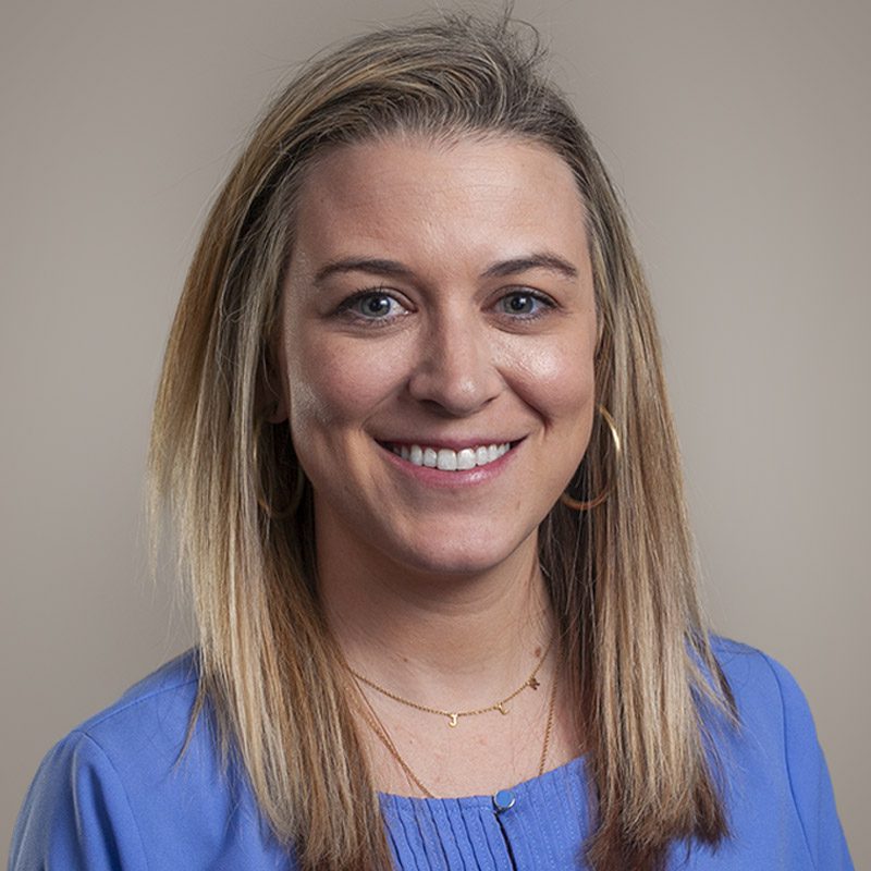 Image of Burkett CPAs Staff Accountant Lauren Reid, smiling, wearing blue shirt