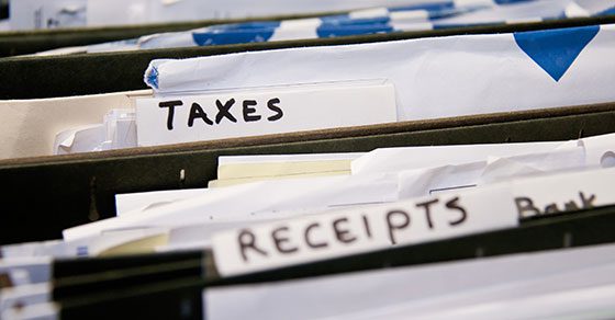 tax documents and receipts in a filing cabinet