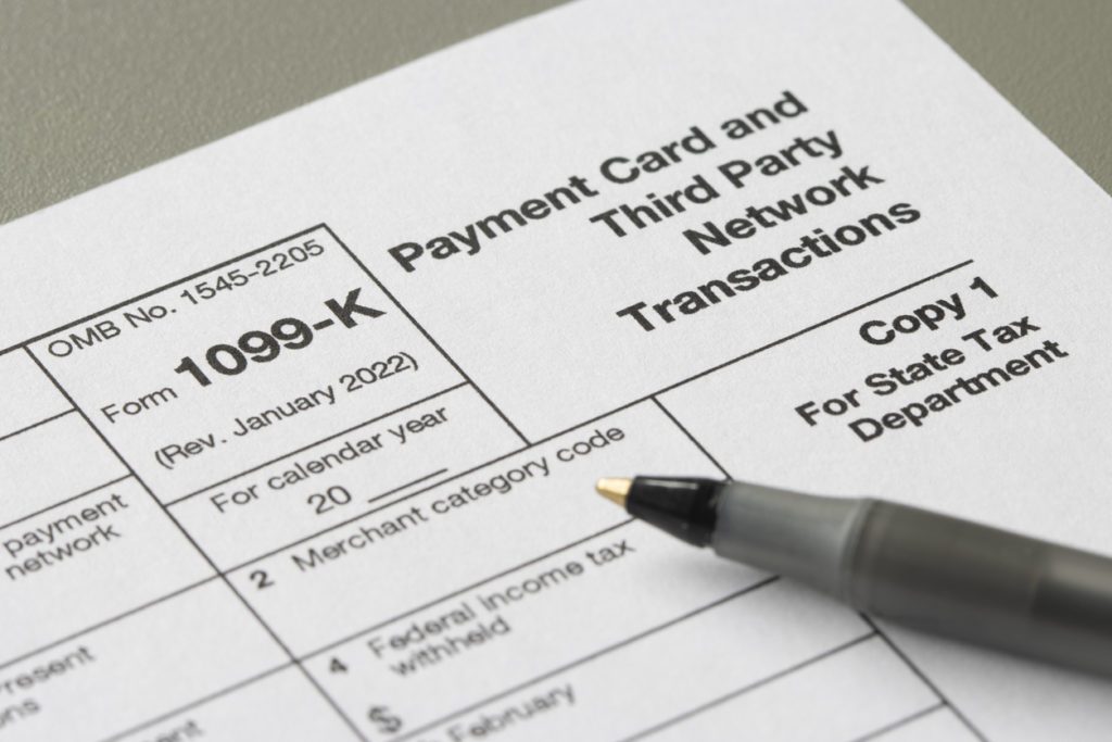 Closeup of Form 1099-K, Payment Card and Third Party Network Transactions, an IRS information return used to report certain payment transactions to improve voluntary tax compliance.