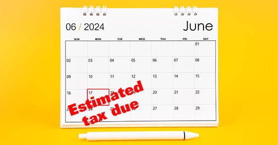 June 2024, Monthly desk calendar for 2024 year and pen on yellow color background.