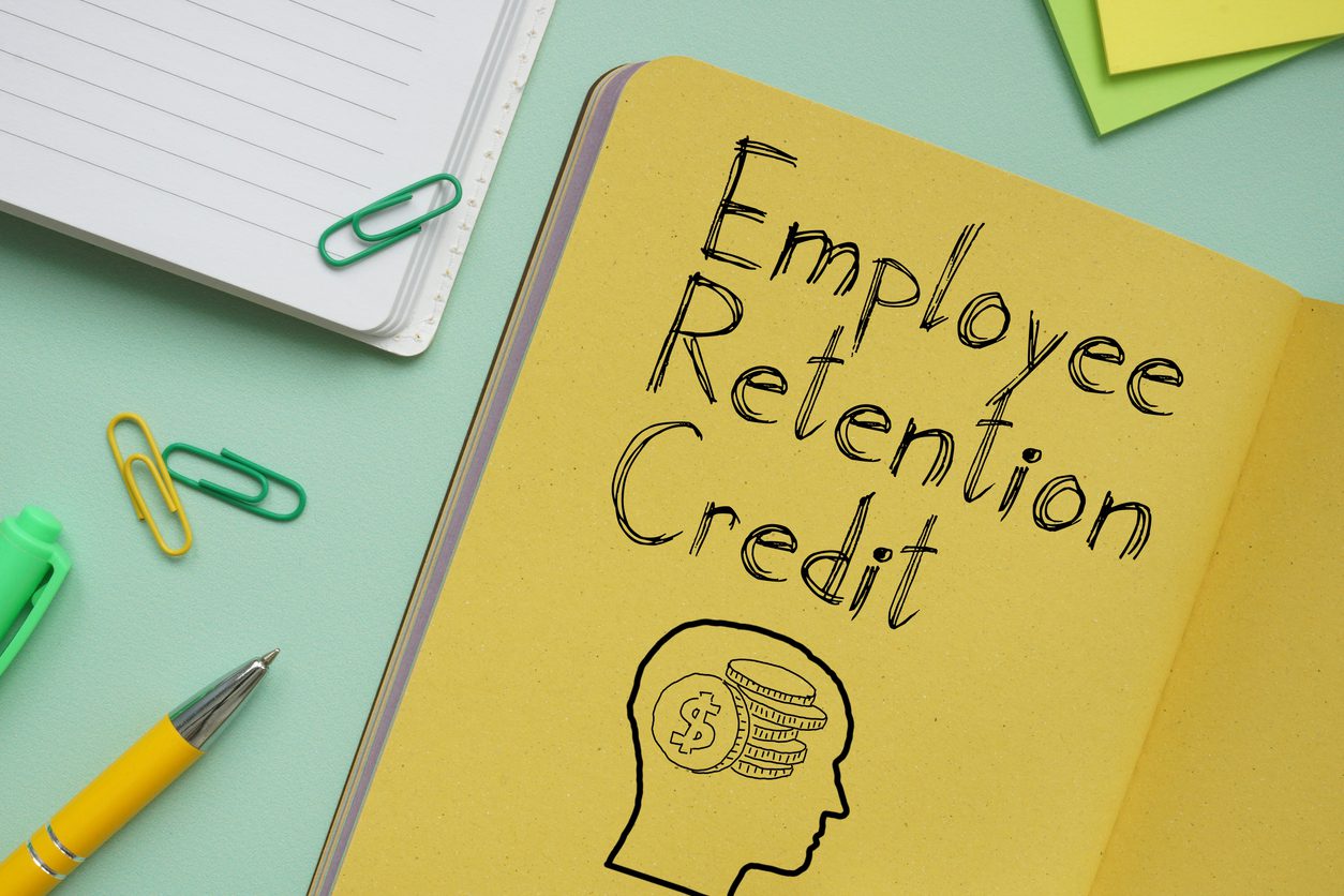 Employee Retention Credit ERC is shown on a business photo using the text