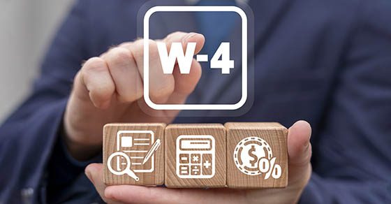 W-4 tax form business finance concept. Taxes document filling.